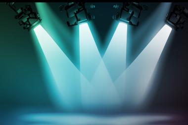 Four spotlights centred on stage
