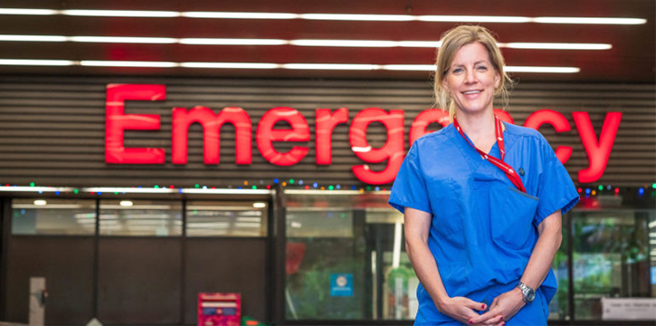 Nurse standing in front of emergency room