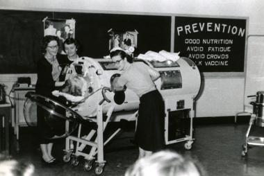 Members of the Class of '58 demonstrate polio treatment