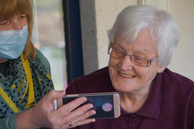 Grandma on phone with caregiver