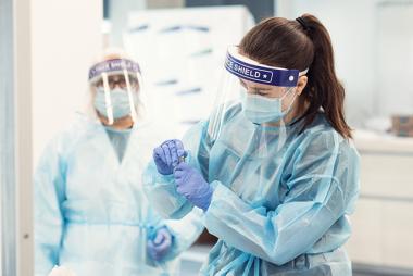 BSN student with faculty member in PPE