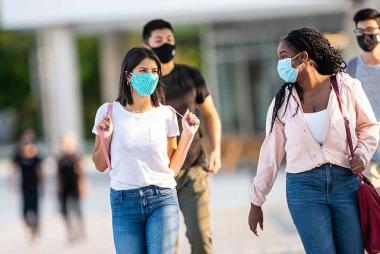 Group of students walk across UBC Campus