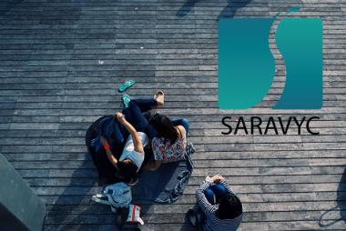 SARAVYC logo over aerial view of youth relaxing on boardwalk