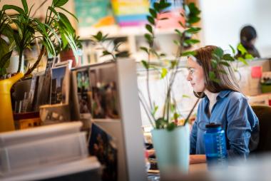 Woman at work in research cubicle by Paul Joseph / UBC Brand & Marketing