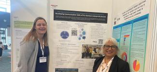 Lydia and Ranjit with poster