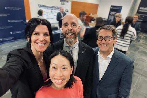 Kristen Haase takes selfie with President Bacon, Dean Olson and Bonnie Leung.