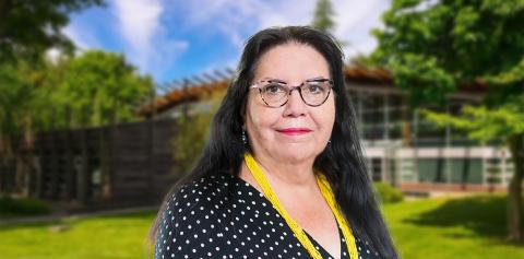 Margaret Moss in front of First Nations House of Learning at UBC