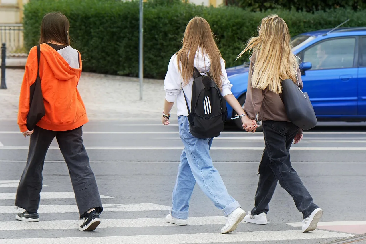 girls crossing street